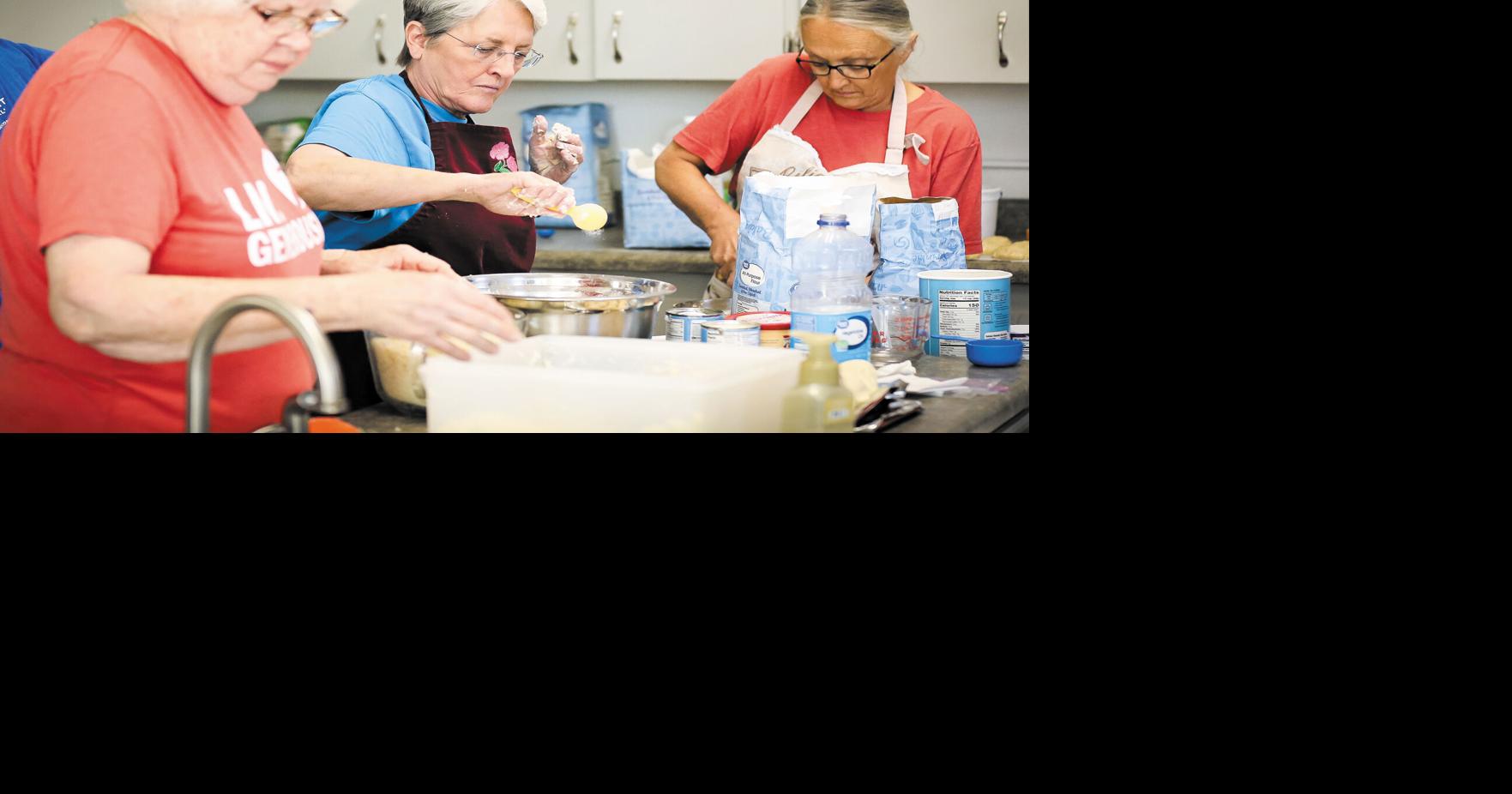 Volunteers at Bethany Lutheran Church in Hatton prep heaping helpings