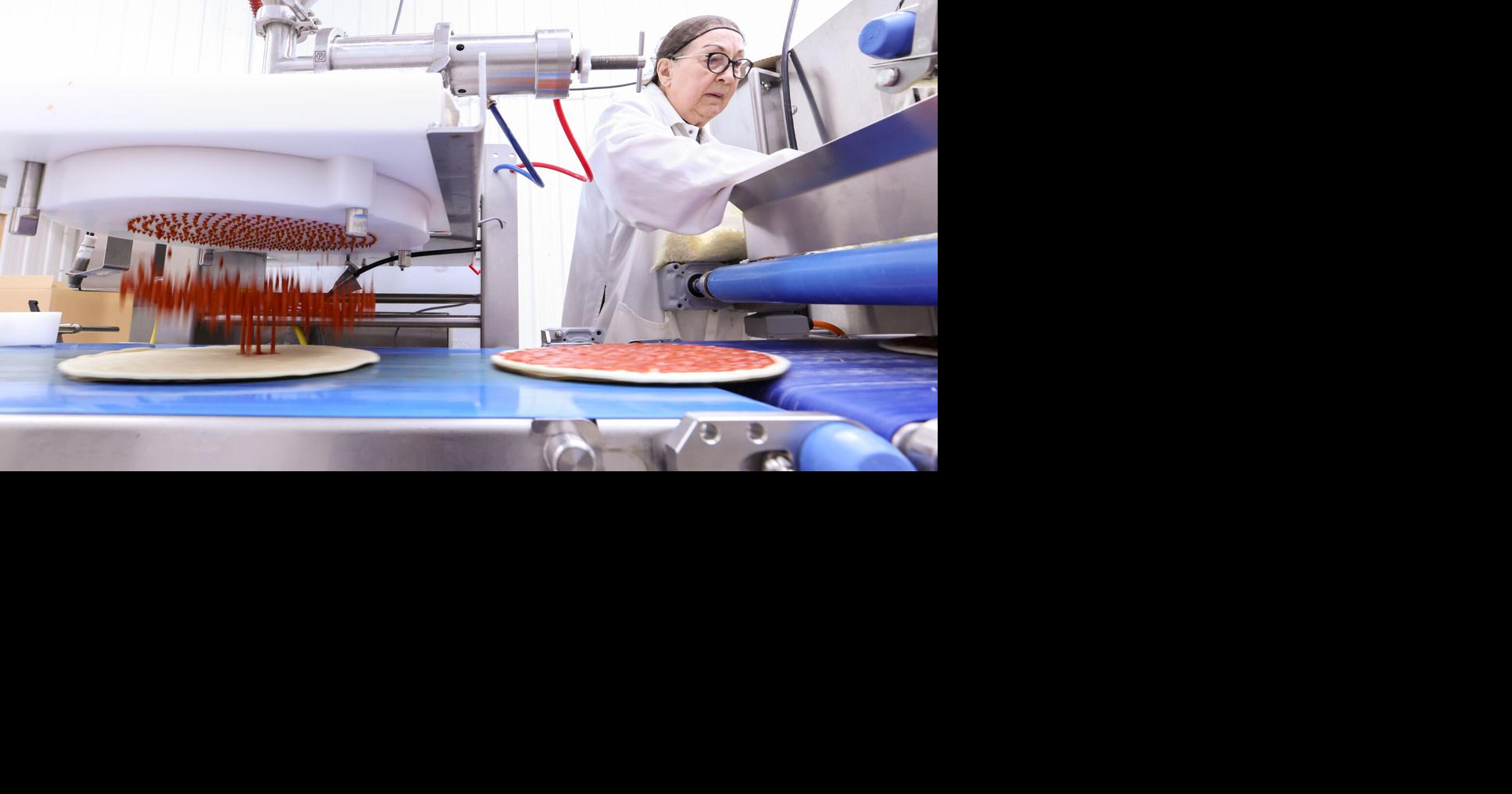 Pizzas roll off the line at Jimmy’s Frozen Pizza in Hatton News