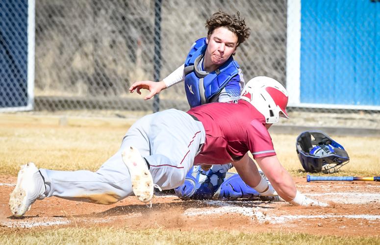 Tyson Leshuk tags out a Carrington runner at home