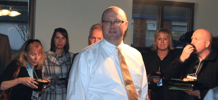 Neil Steschschulte speaks at RE Tour.jpg