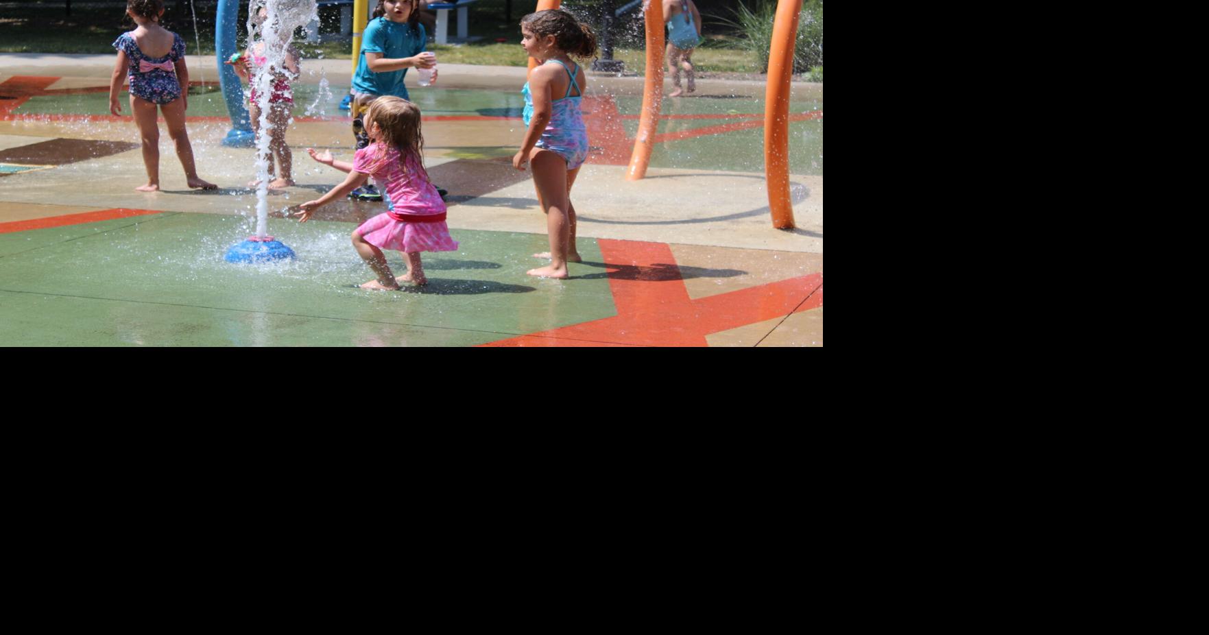 COOLING OFF photos of Milton splashing around at Goodrich Square