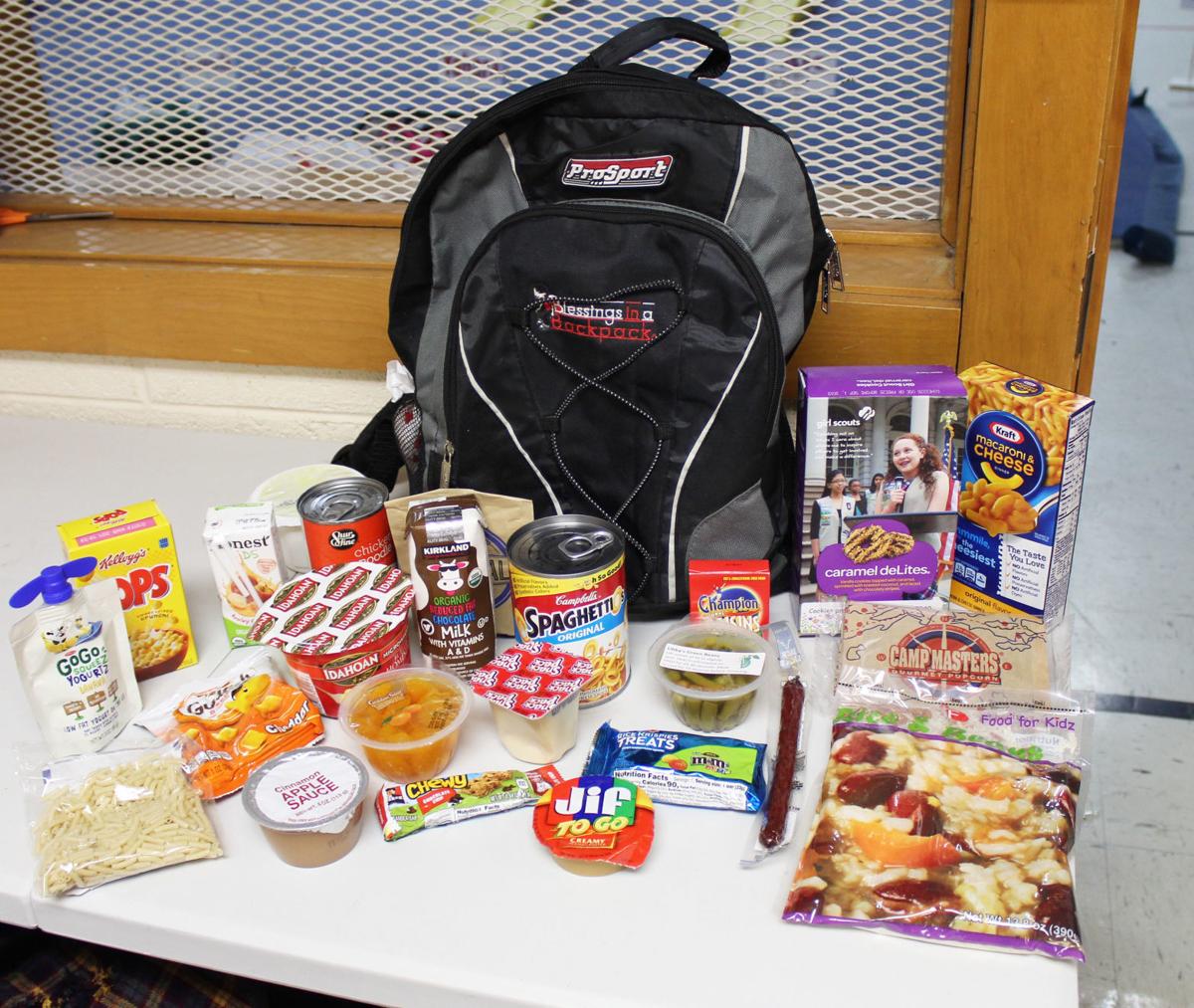 Blessings in a Backpack volunteers help feed students, educate locals