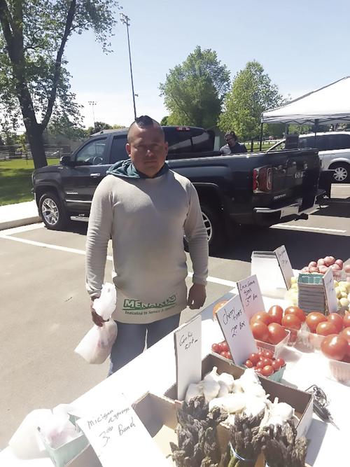 Farmers' market selling tomatoes