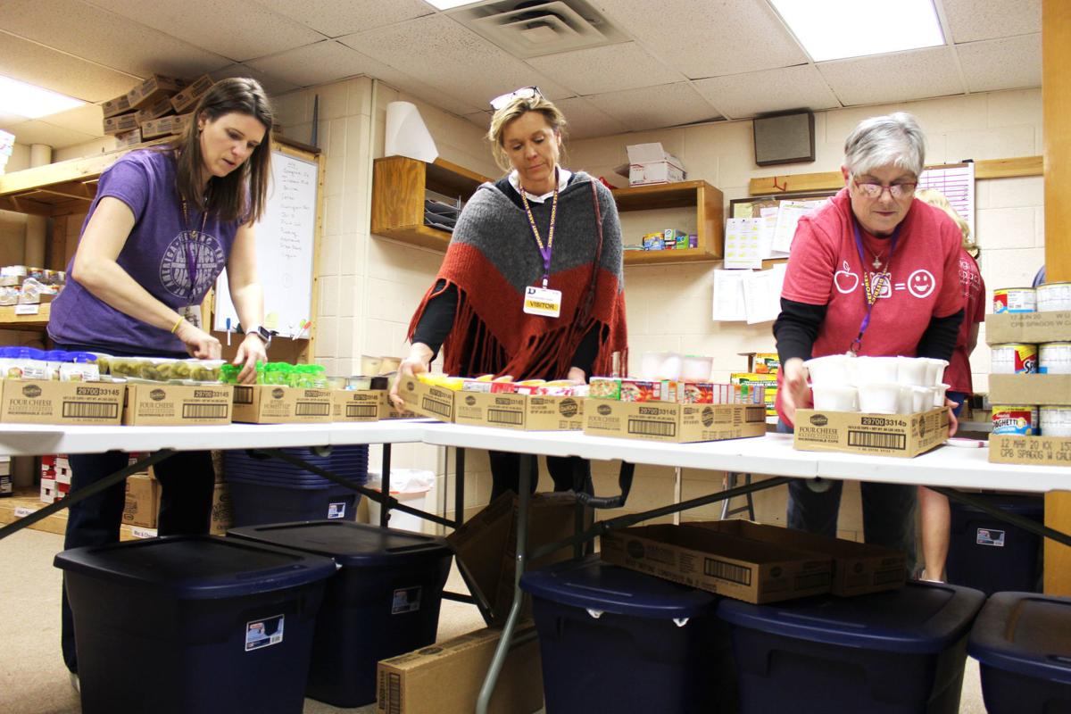 Blessings in a Backpack volunteers help feed students, educate locals