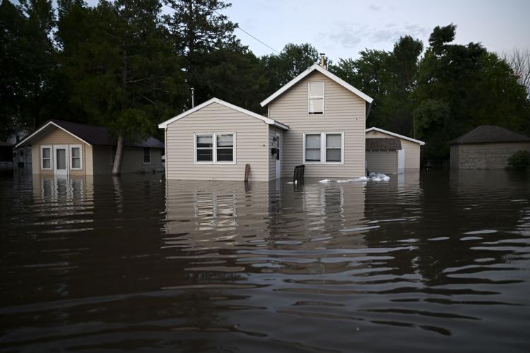 Heavy rainfall in upper Midwest causes evacuations, bridge collapses ...