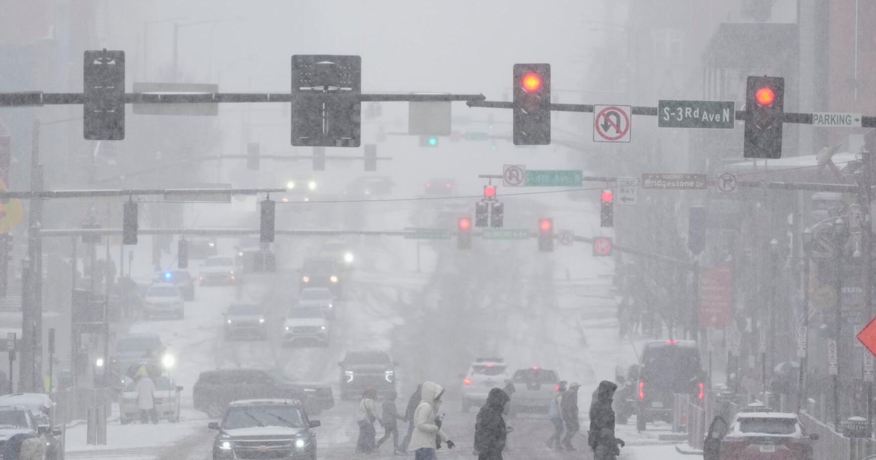 People brace themselves for the winter storm moving across the US , in photos