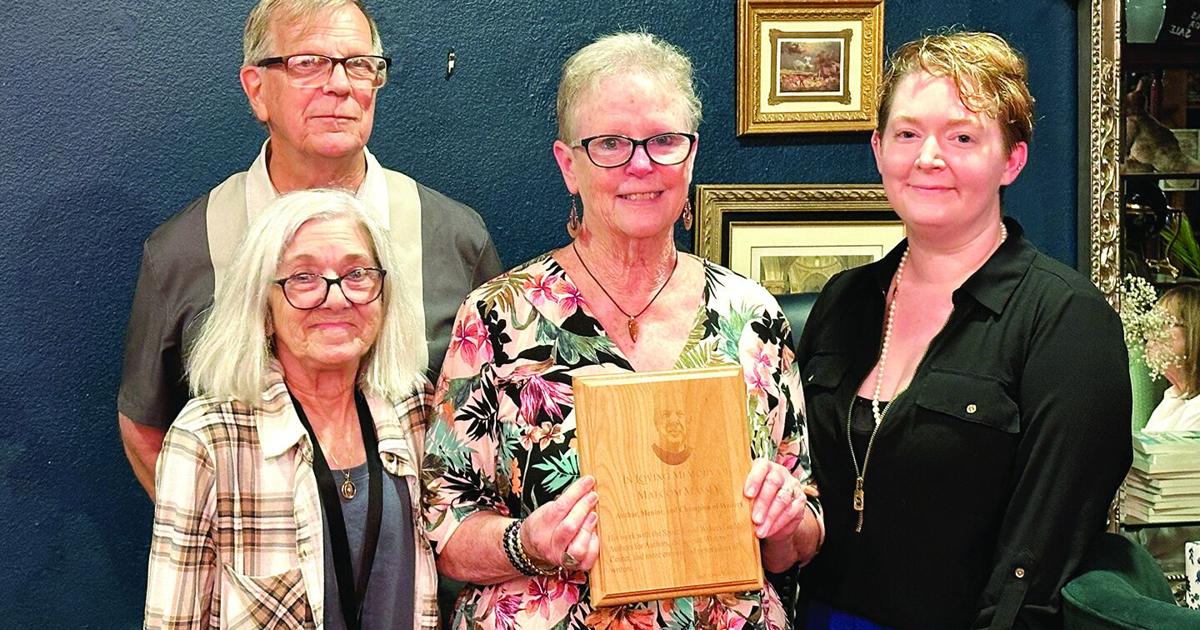 Writers remember mentor with plaque at Moon River Café