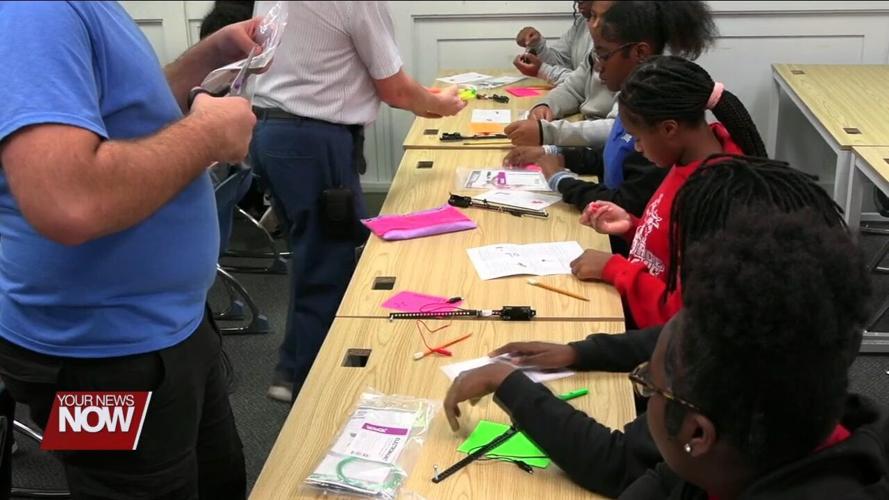 Heir Force students build electromagnets with the help of volunteers from Procter & Gamble