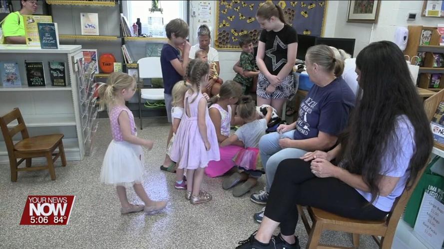Volunteers from Deb's Dogs chat with kids at Cairo library about animal rescue and responsible ownership