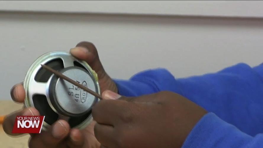 Heir Force students build electromagnets with the help of volunteers from Procter & Gamble