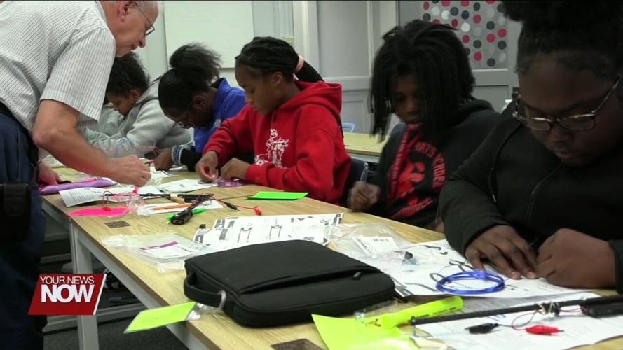 Heir Force students build electromagnets with the help of volunteers from Procter & Gamble