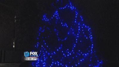 Rhodes lights a Memorial Tree to honor fallen officers