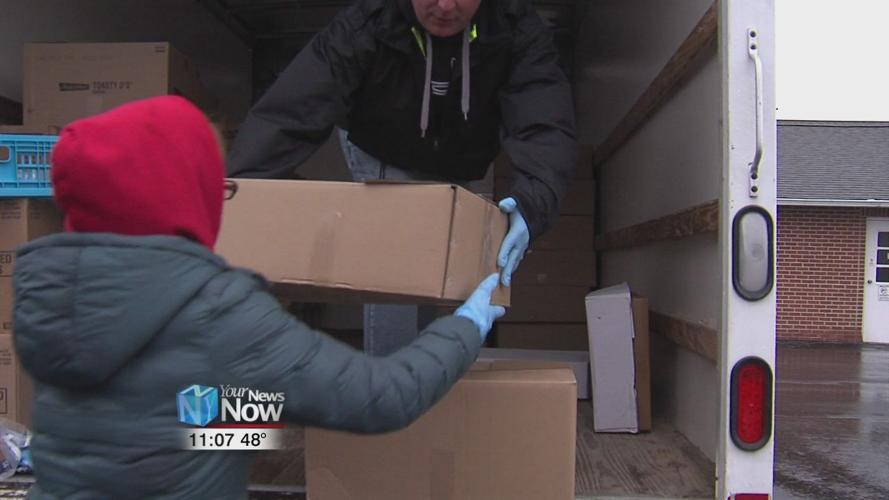 Area volunteers donating food to those in need