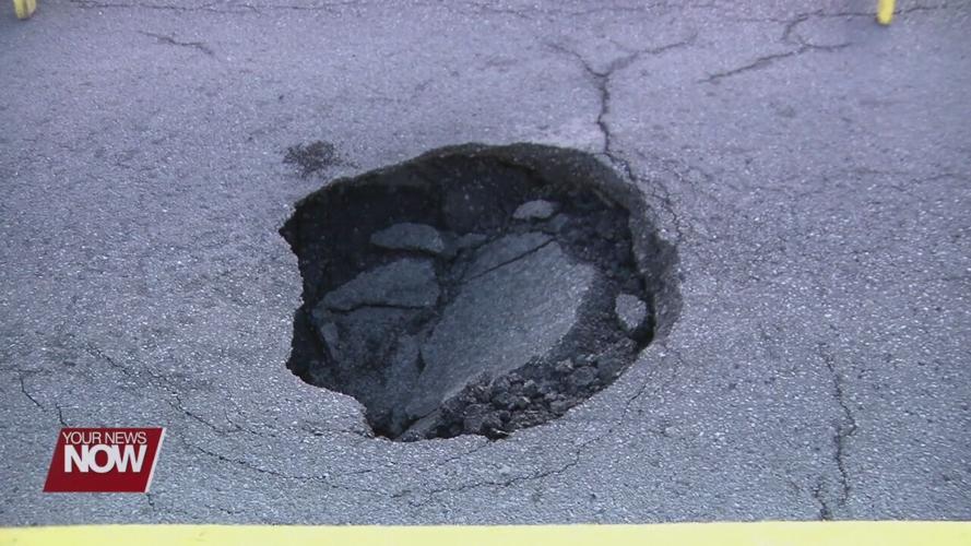 Sinkhole damages South Metcalf Street