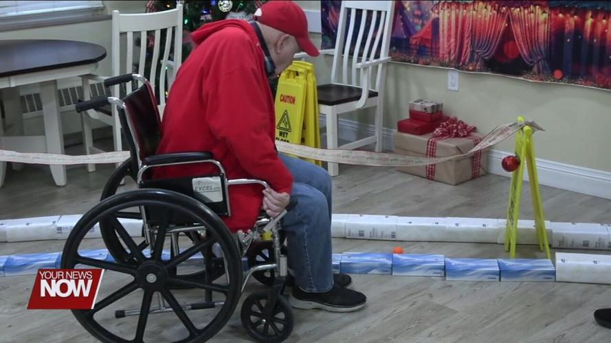 Lima Convalescent Home residents show off their putt-putt golf skills