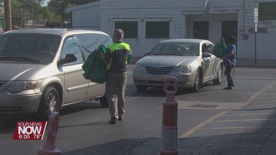 Drive thru bike helmet and food distribution in Lima