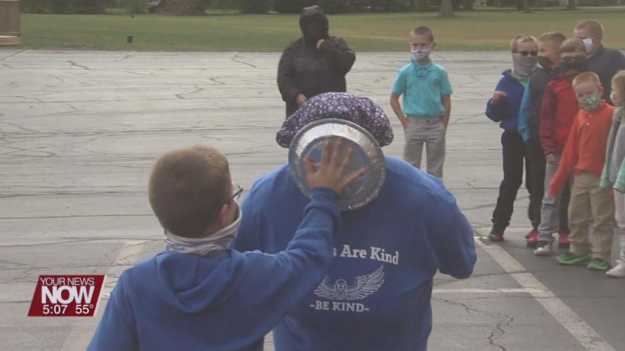 St. Anthony's staff get a pie in the face thanks to the hard work of their students