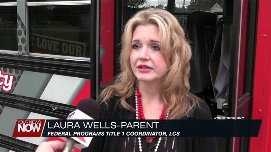 Lima City Schools' Spartan Ride receives book donation from OSU Lima Education Club