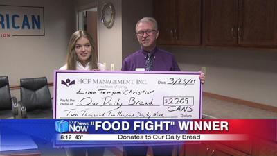 Food Fight winner, Temple Christian, donates to Our Daily Bread 1.jpg