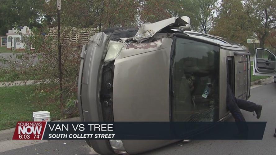 Lima Police investigating crash involving a minivan hitting a tree and coming to rest on its side