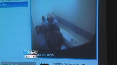 Holding cell fight shown to jury during murder trial