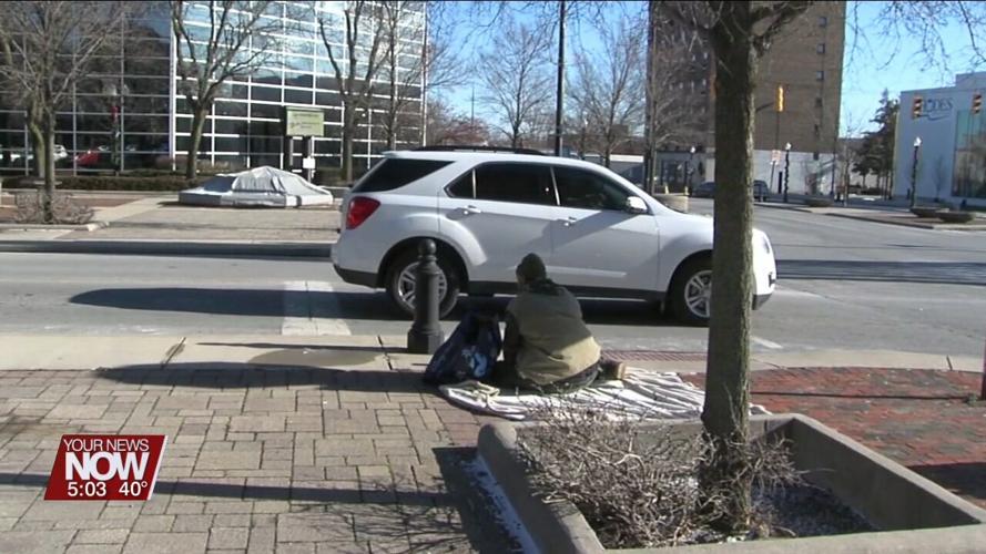 Police and other local organizations working to provide food and shelter for the homeless