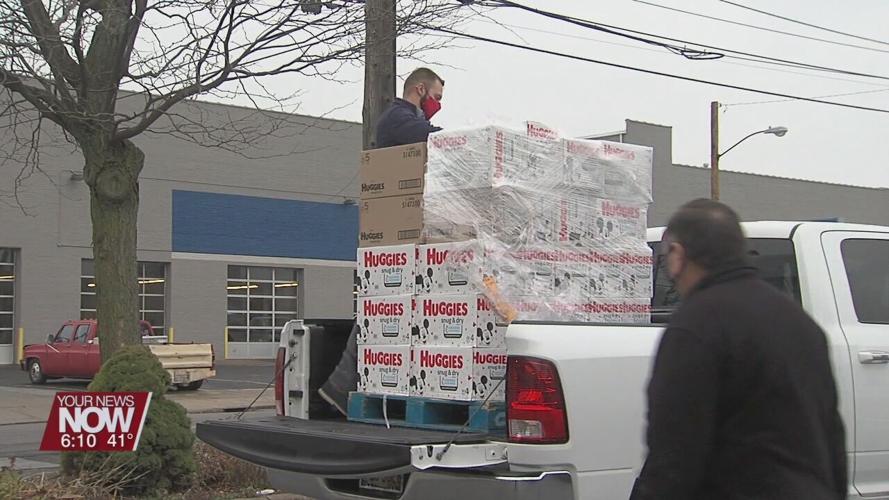 Family Promise is given donation of diapers from Chief Supermarkets