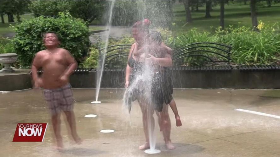 Families visit Faurot Park to cool off at the Children's Fountain