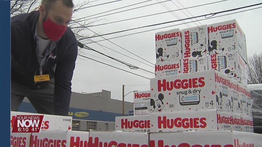 Family Promise is given donation of diapers from Chief Supermarkets