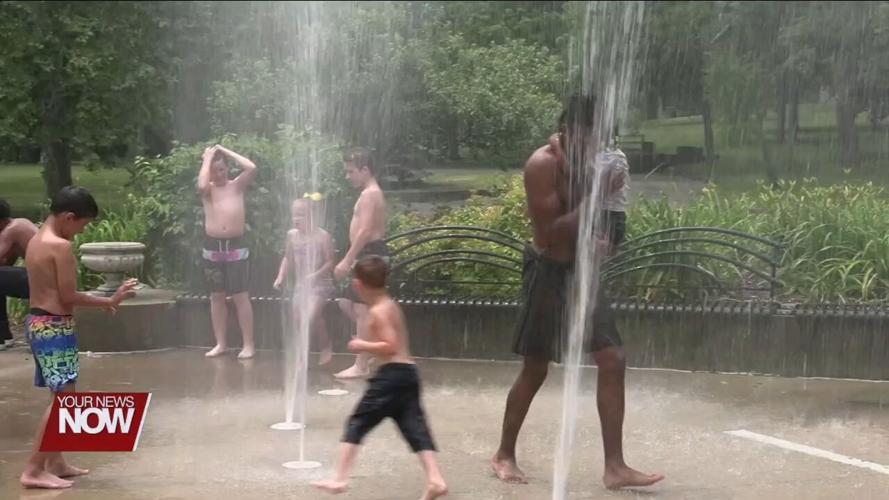 Families visit Faurot Park to cool off at the Children's Fountain