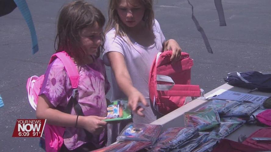 Wireless Zone donates backpacks to kids for the upcoming school year