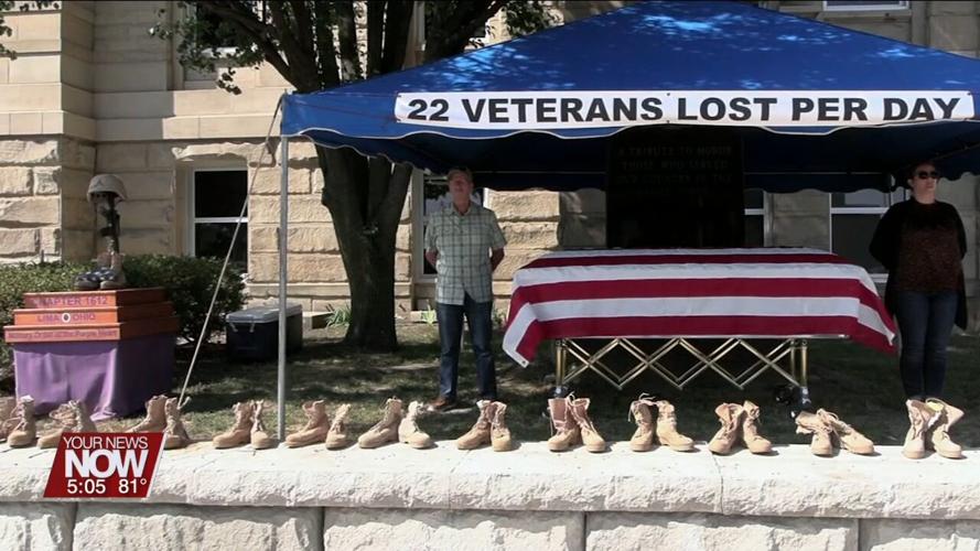 Veterans and volunteers stand watch to promote suicide awareness in front of the Allen County Courthouse
