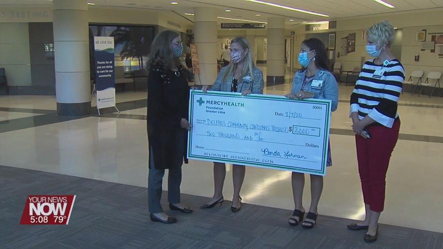 Mercy giving the Delphos Christmas Community Project a $2,000 donation