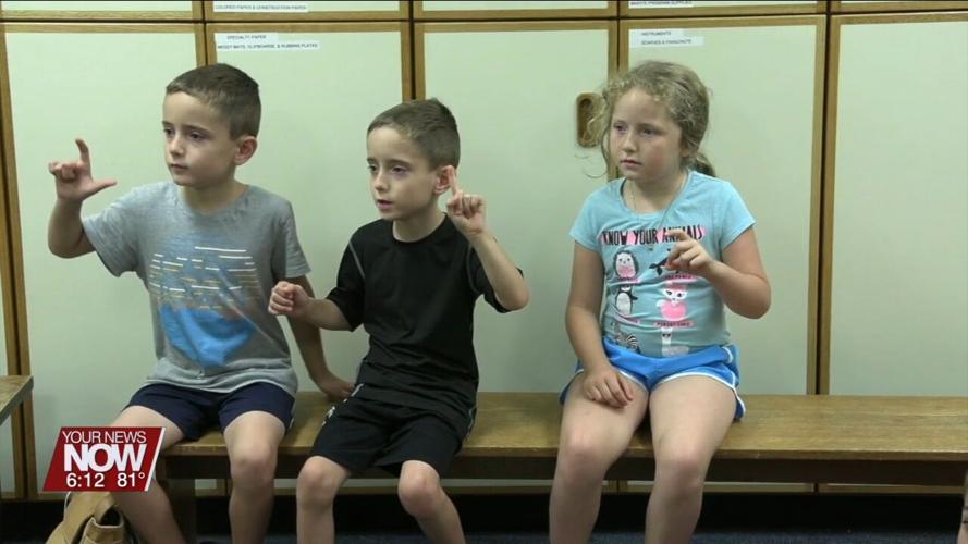 Children are learning basics of the American Sign Language at Lima Public Library