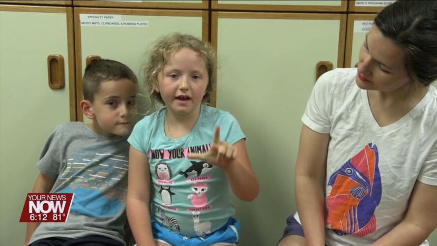 Children are learning basics of the American Sign Language at Lima Public Library