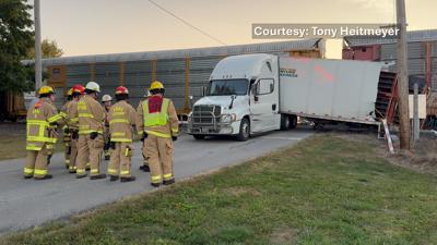 Semi trailer cut in half after possible malfunction leads to train crash