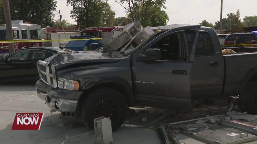 Pickup driver hits Lima strip mall while he is being assaulted