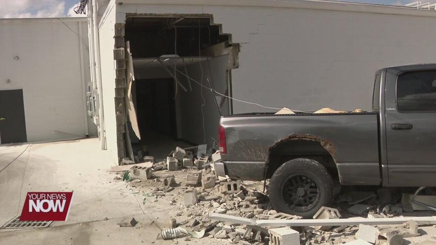 Pickup driver hits Lima strip mall while he is being assaulted