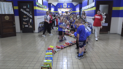 Delphos St. John's students celebrate donation to service group with domino fun