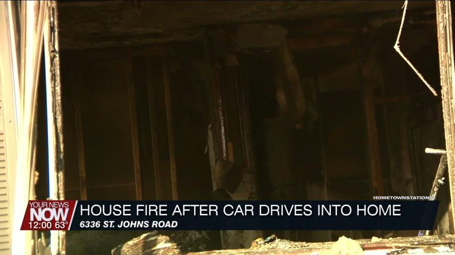 Multiple fire crews assist with fire after a vehicle crashes into a Perry Township home