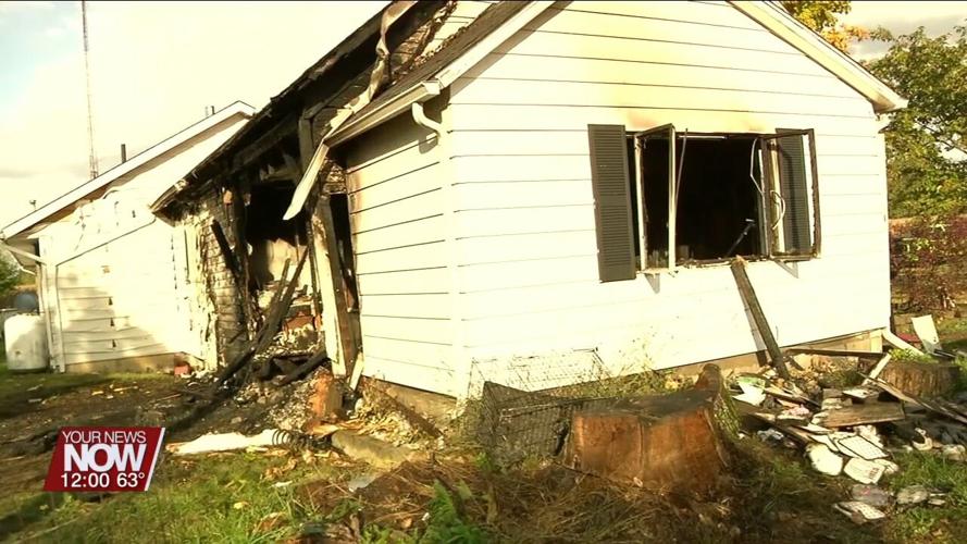 Multiple fire crews assist with fire after a vehicle crashes into a Perry Township home