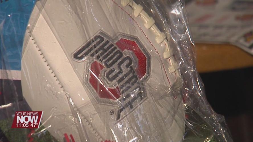 Lima residents gather to watch The Game and show their scarlet and grey pride