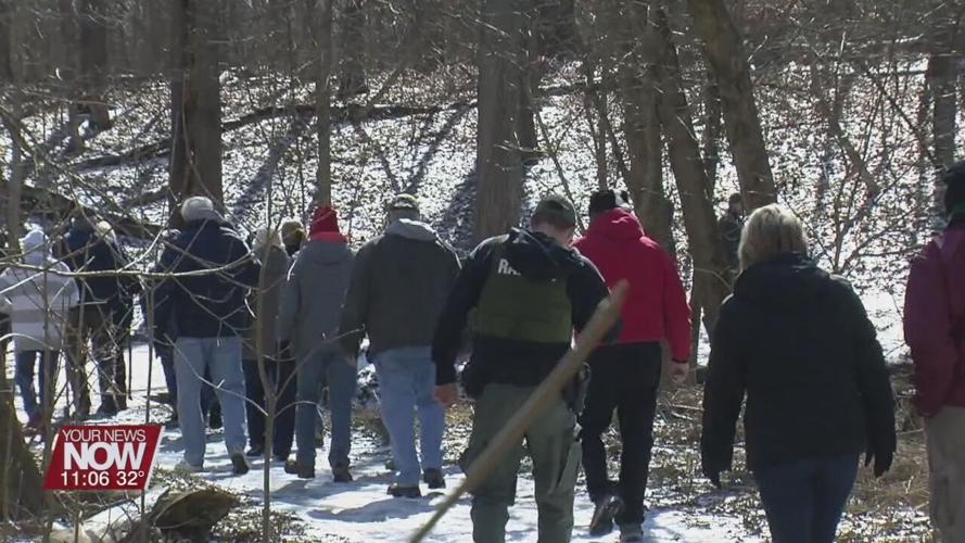 People hike through Kendrick Wood in search for the signs of Spring