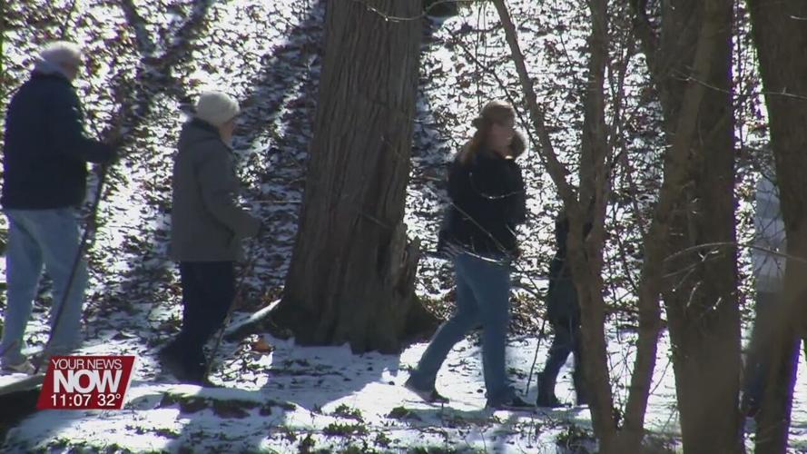 People hike through Kendrick Wood in search for the signs of Spring