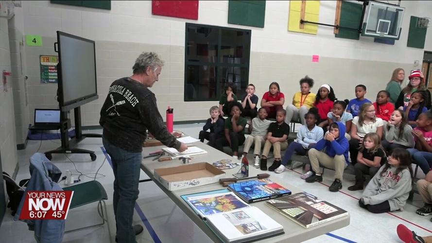 Students at Liberty Arts Magnet get a demonstration of how to create stained glass