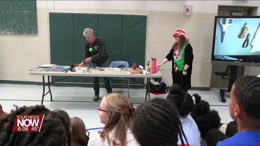 Students at Liberty Arts Magnet get a demonstration of how to create stained glass