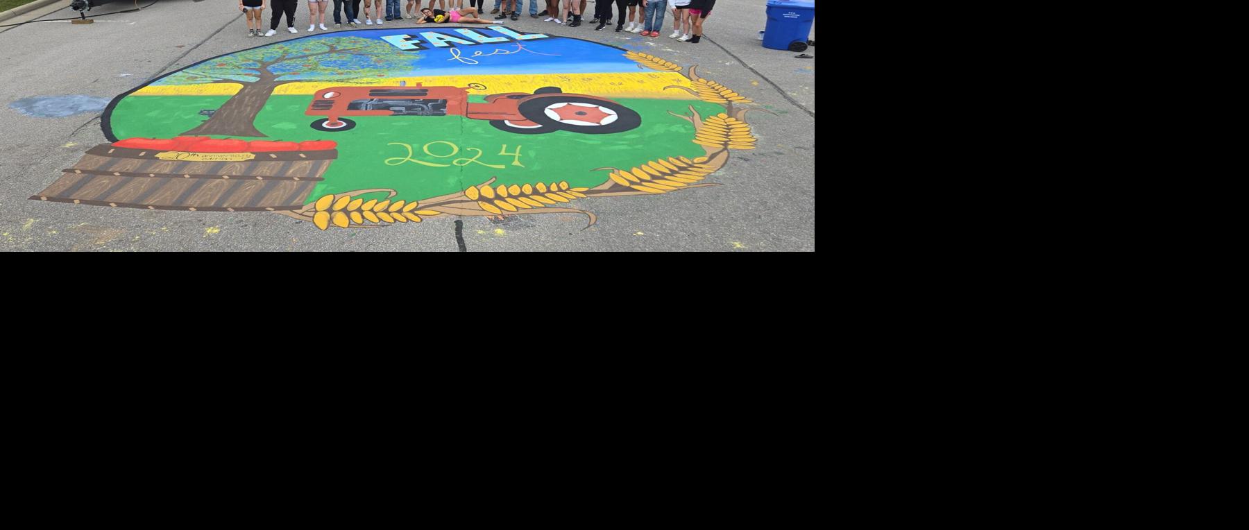 High School Art Club students paint mural on Main Street for annual Continental Fall Festival