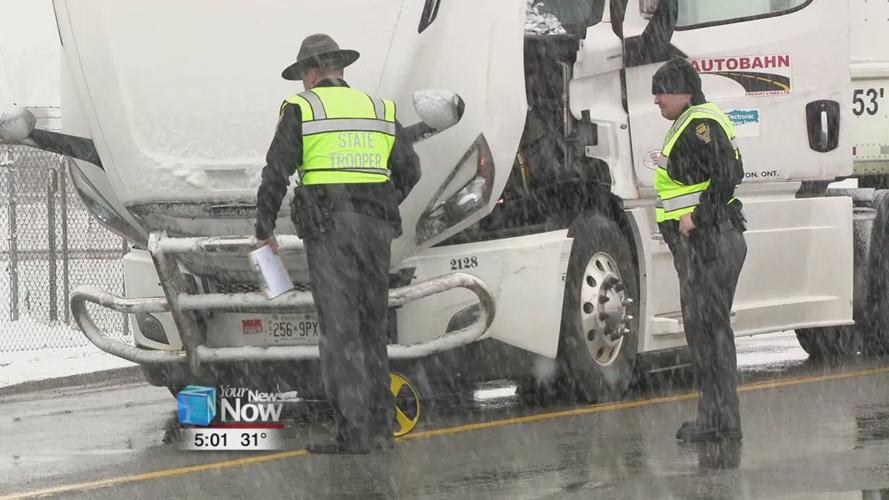 Car crashes into semi, driver and passengers sent to hospital