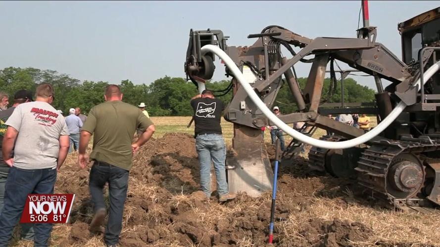Farmers get a chance to see technological advances in the installation of drain tile at Ohio State Lima