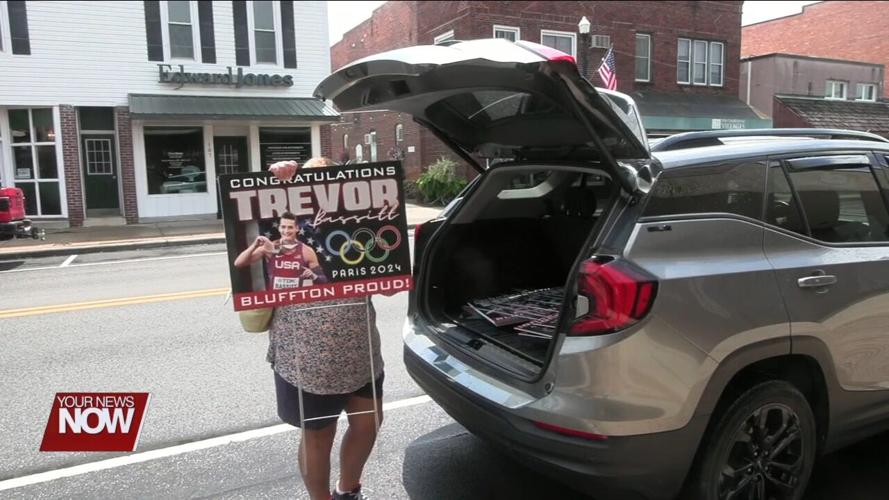 Two Bluffton women show local Olympian Trevor Bassitt support by covering community in signs